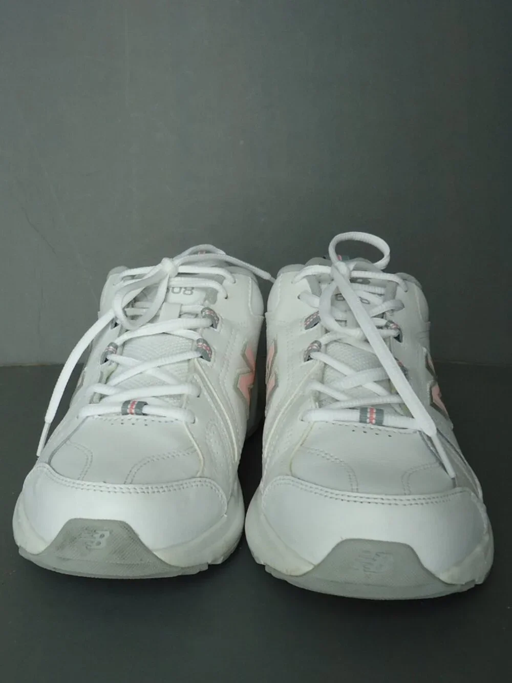 SIZE 9.5. D. New Balance women's white leather sneakers shoes.